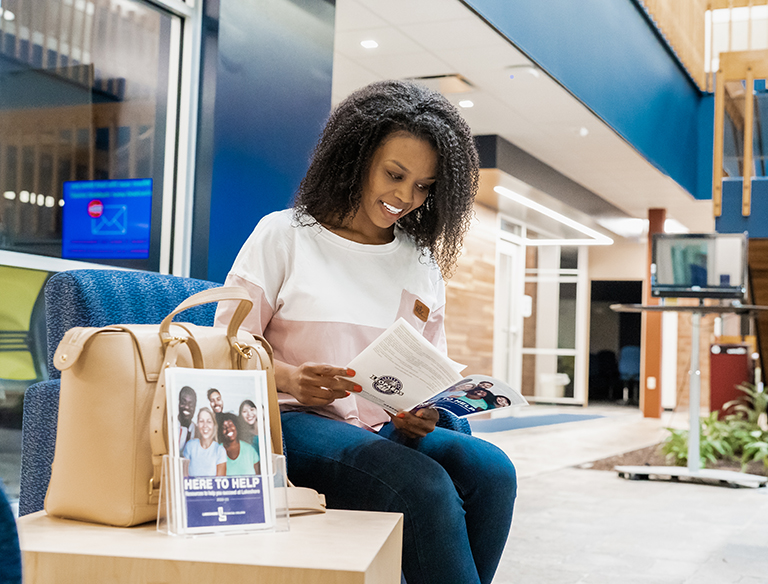 Student looking at a pamphlet 