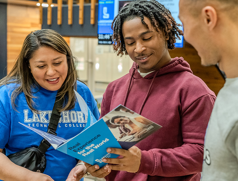 Students looking at some paper