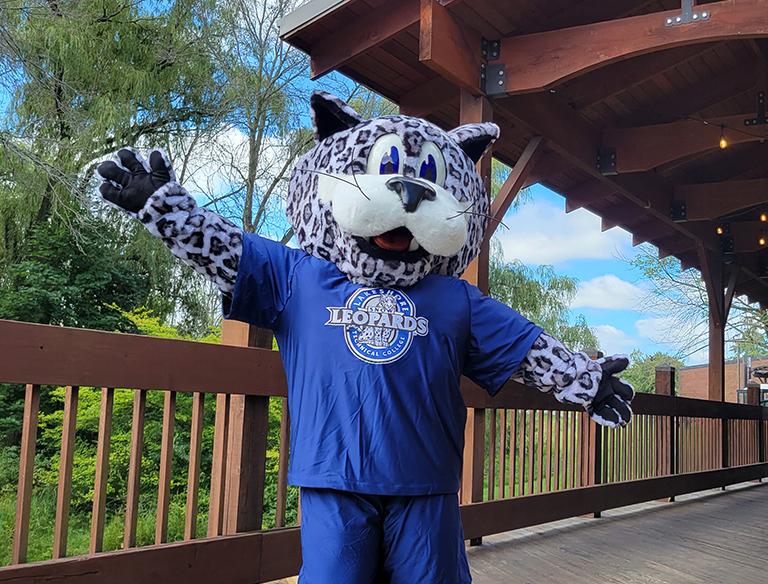 Lenny standing in front of Lakeshore's Bridge