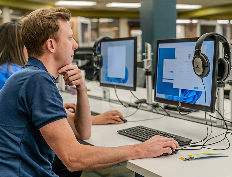 Man looking at a computer