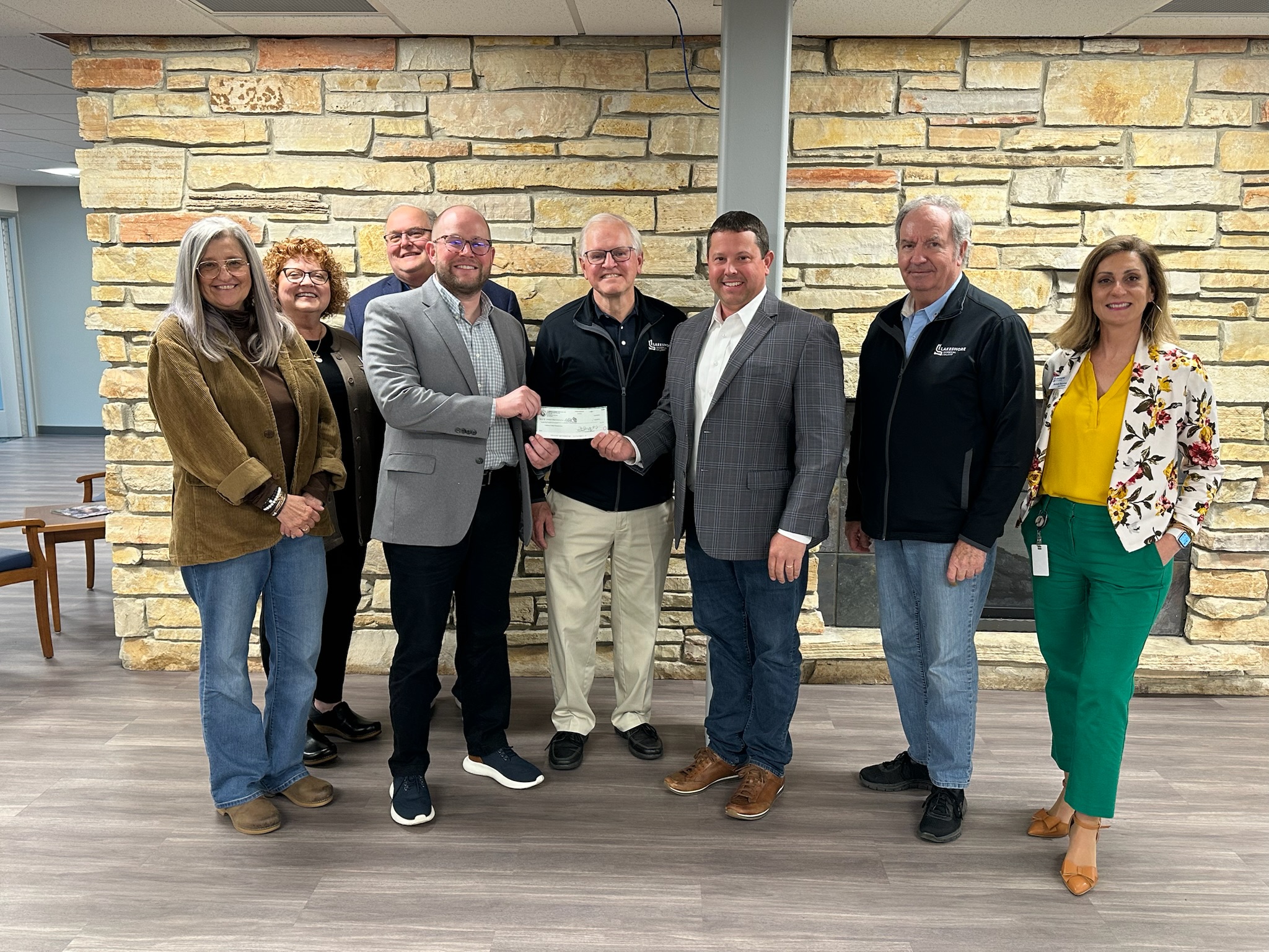 Dustin Delsman from Plumbers & Steamfitters UA Local 400 presents a $25,000 check to Lakeshore College President Dr. Paul Carlsen for the establishment of a scholarship fund.