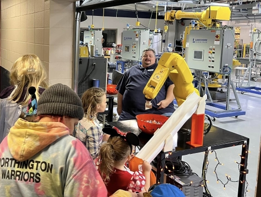 Trick-or-treaters visited the robotics lab where a robot distributed treats during Lakeshore Technical College’s 2022 College, Candy, & Carving event.