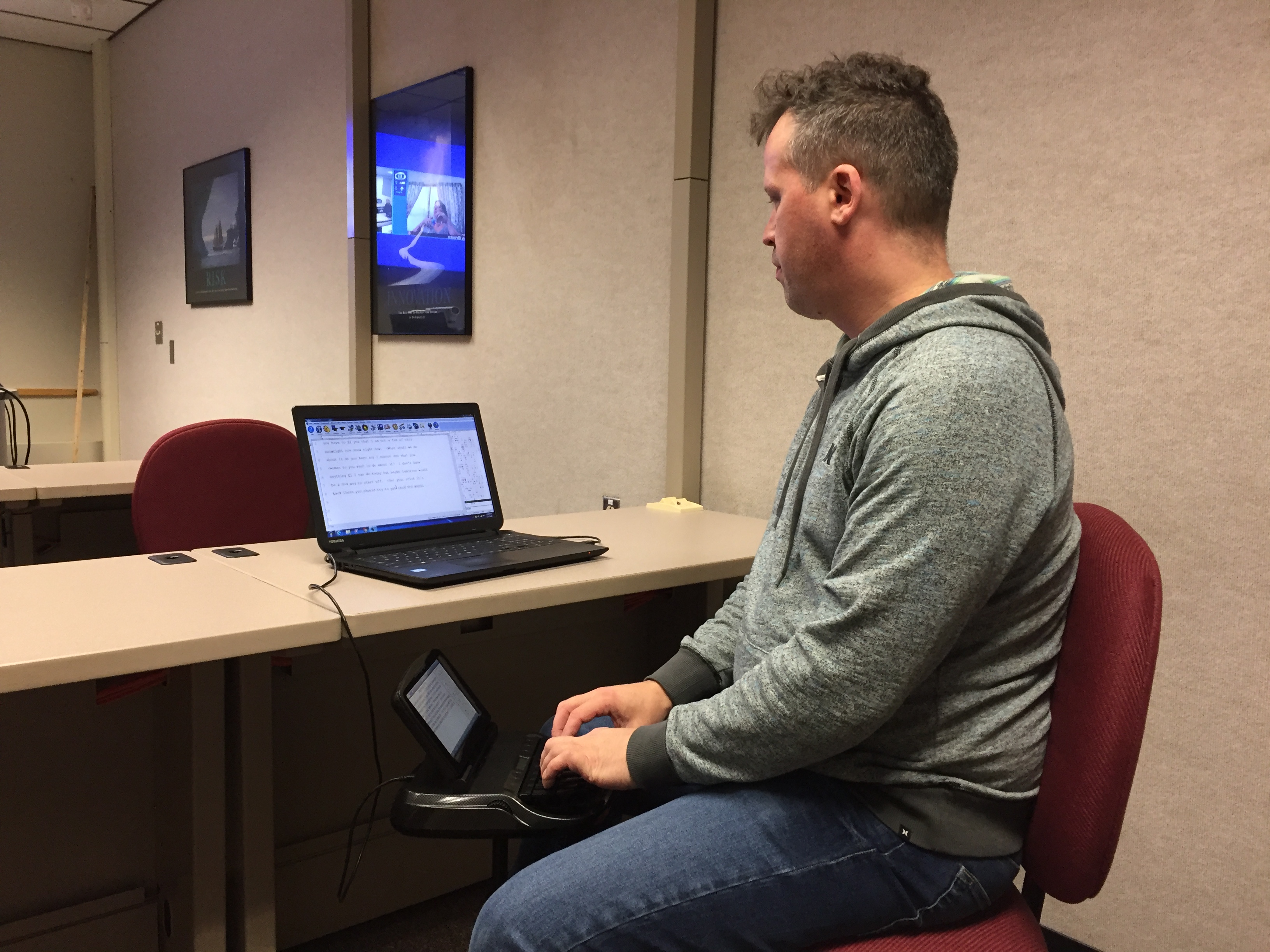 A former LTC student works at developing his court reporting skills.